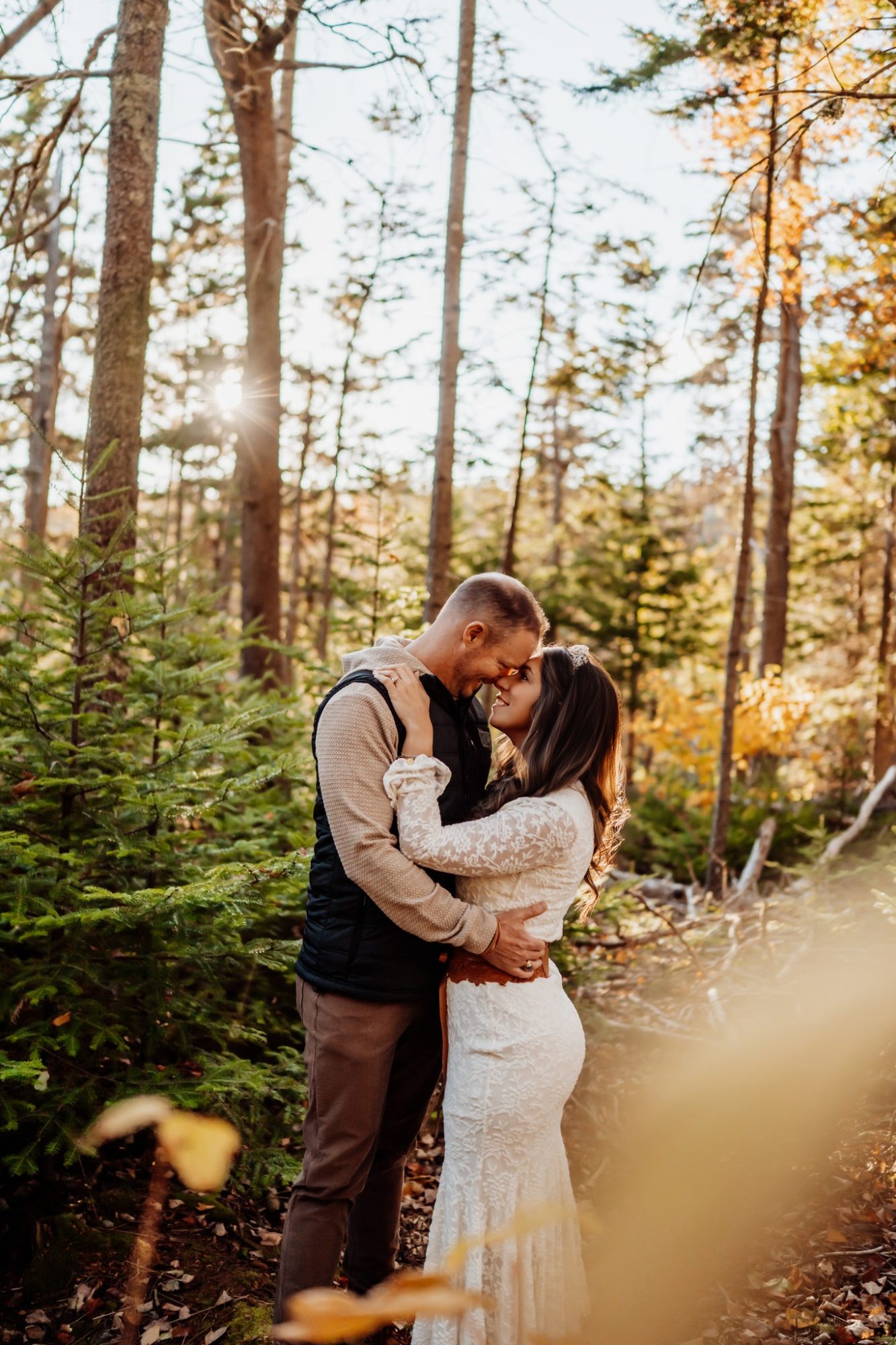 Romantic forest portrait during golden autumn elopement in Acadia National Park