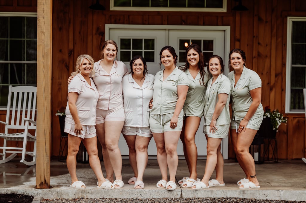 bridesmaids dressed in pajamas in front of wedding venue