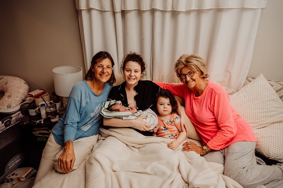 Woman giving birth at home