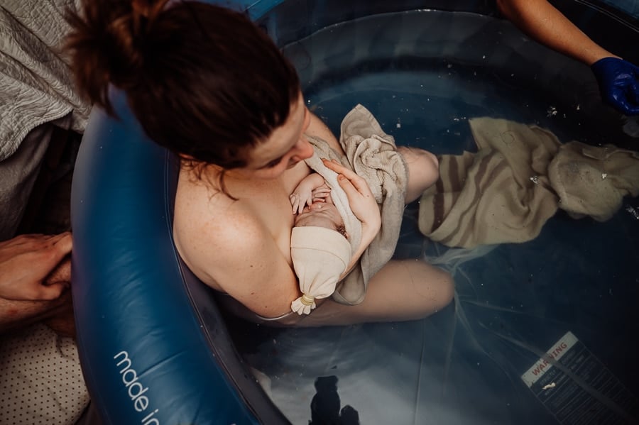 Woman giving birth at home in Maine
