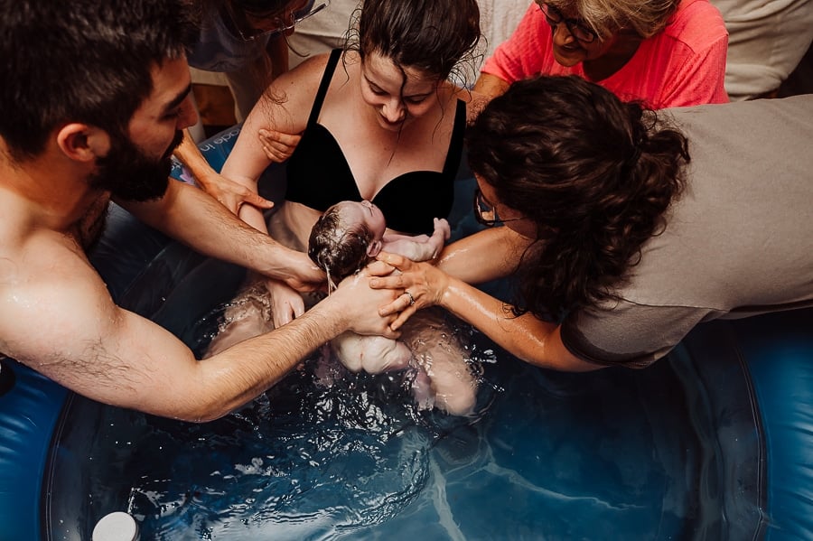 Mother giving birth at home