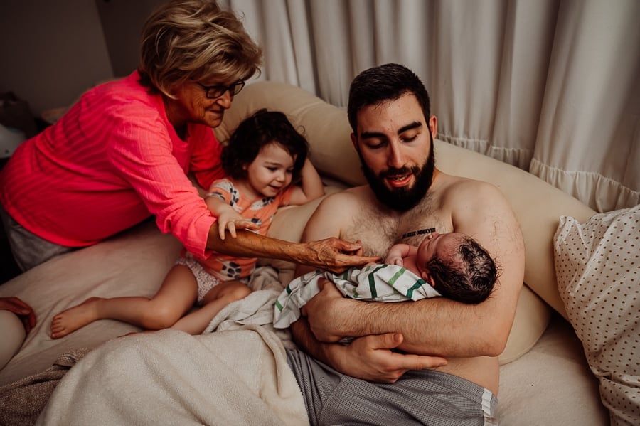 Woman giving birth at home
