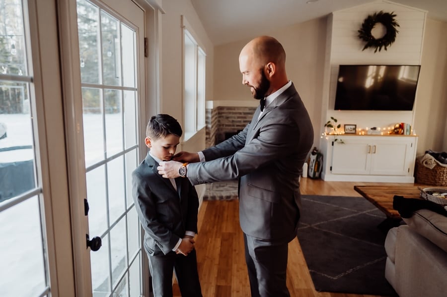 Groom fixing ring bearers bow tie