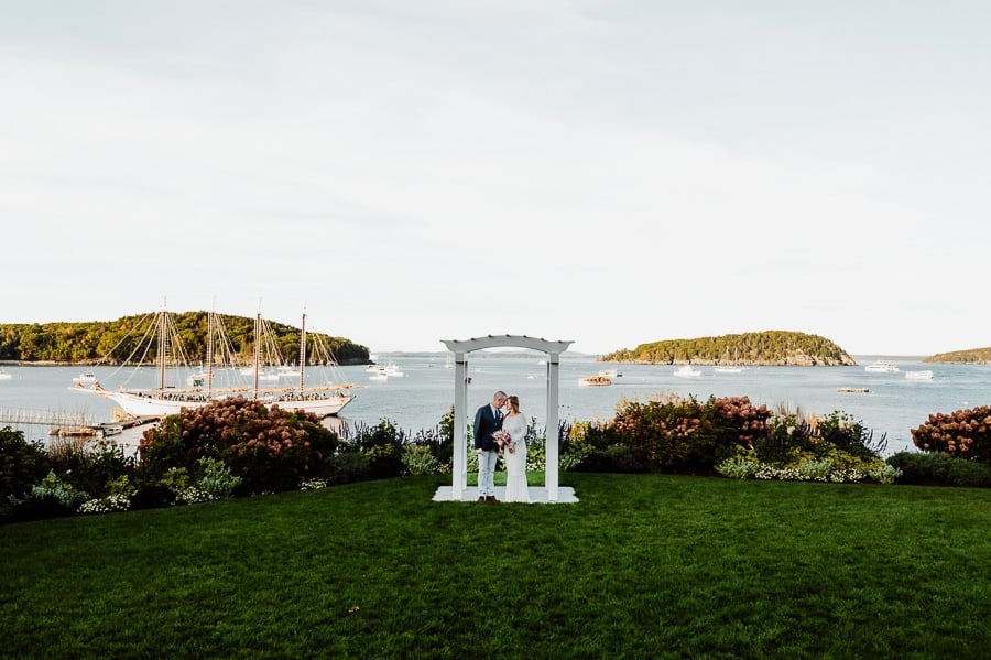 Bride and groom at alter in front of Bar Harbor Inn