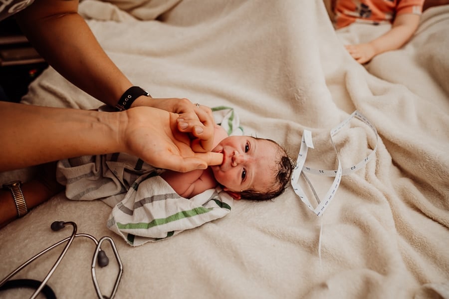 Woman giving birth at home