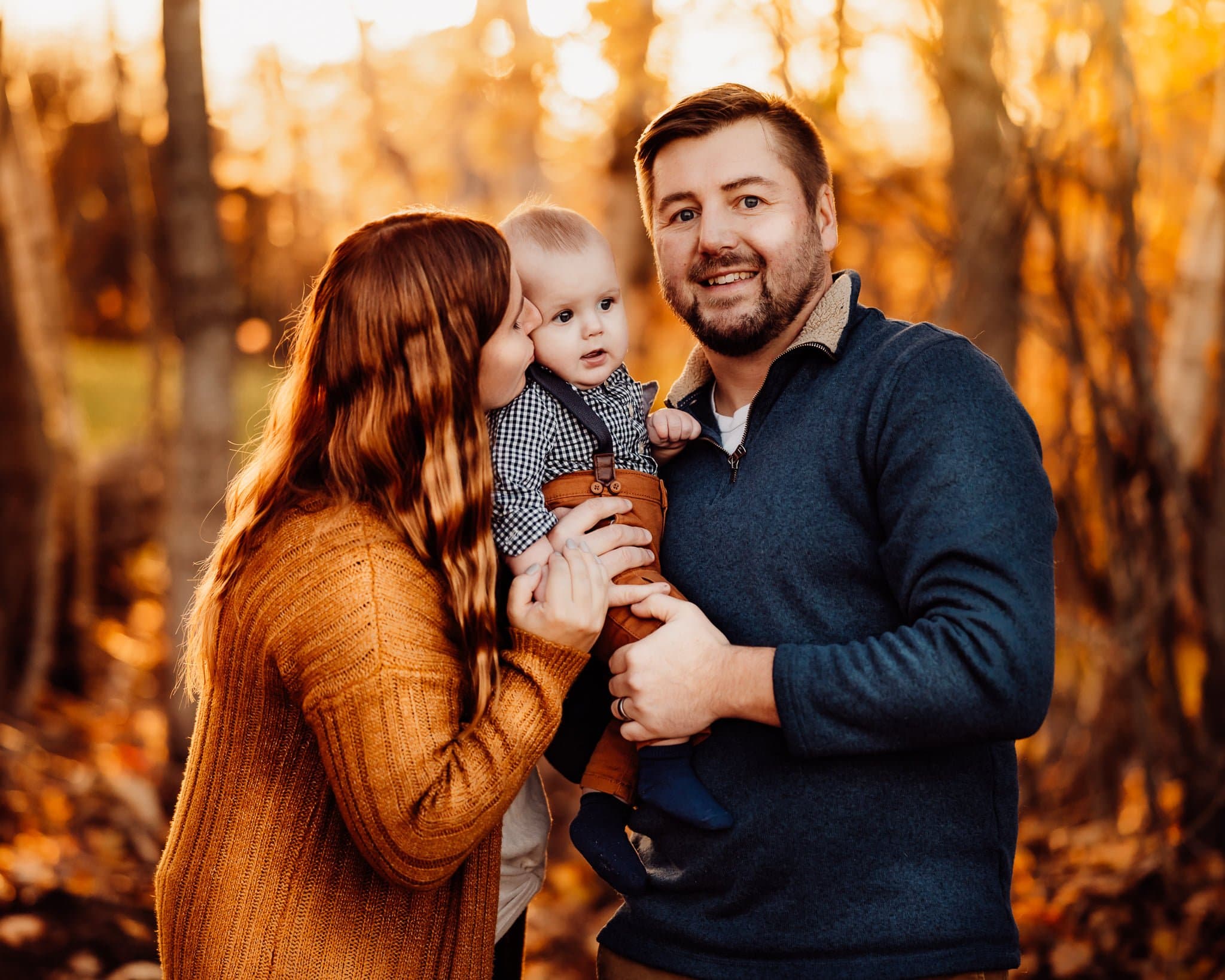 Family photo with baby against fall background
