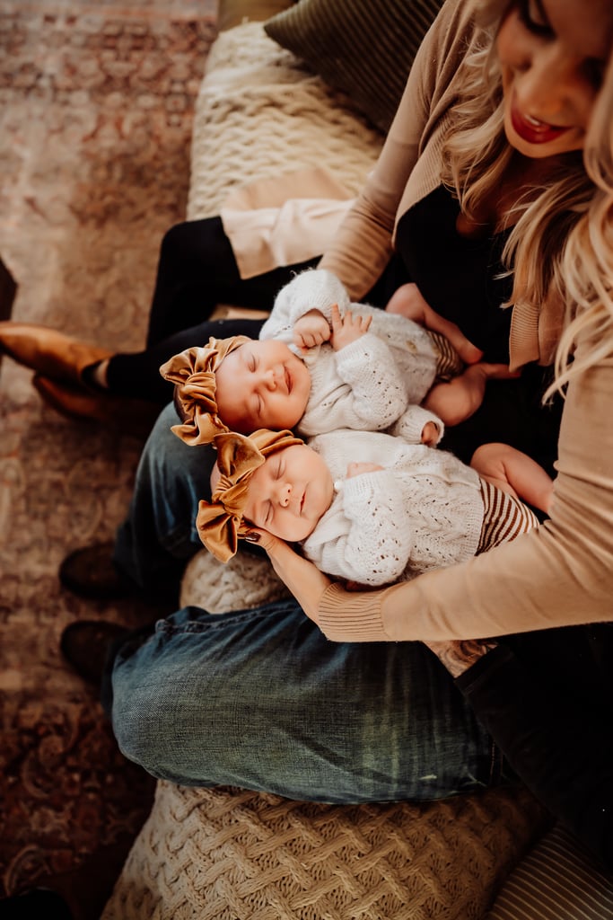 Twin newborn girls posing in home