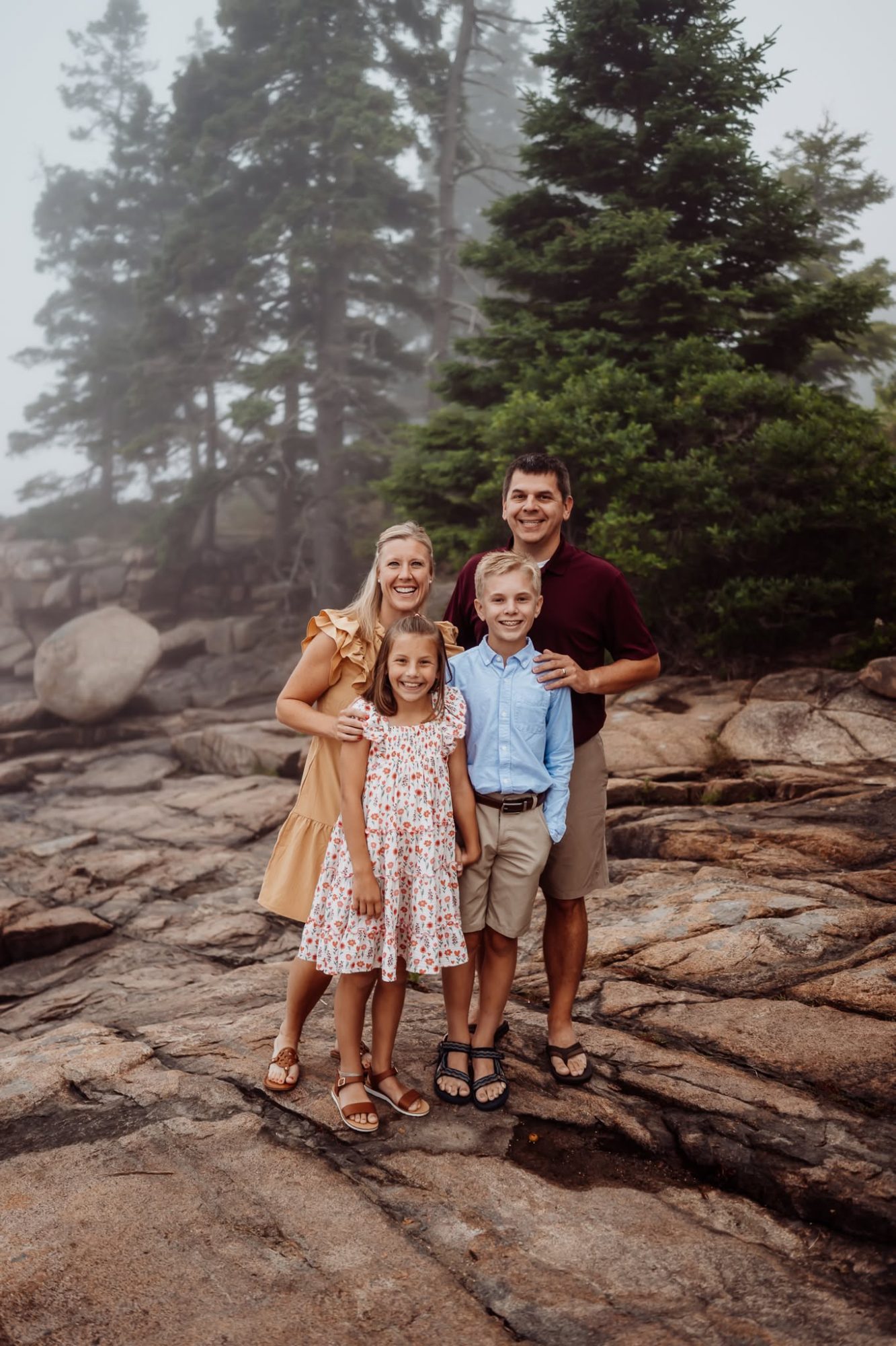 Family on the coast in fog