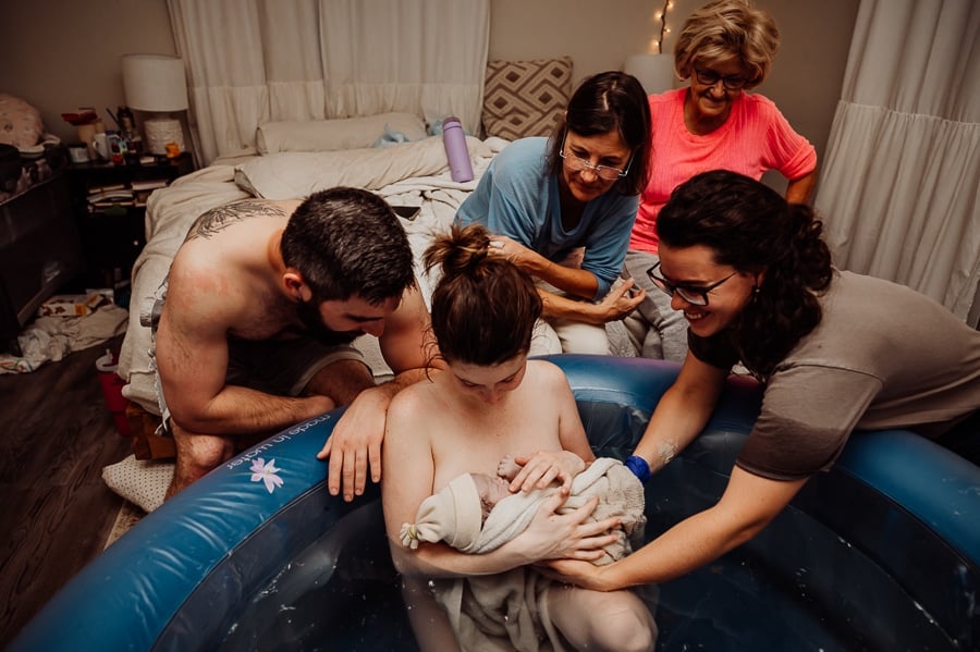 Woman giving birth at home in Maine