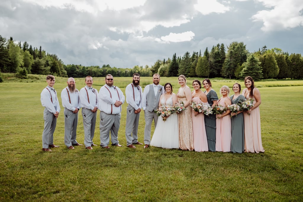 bridal party lined up at sunset meadows venue