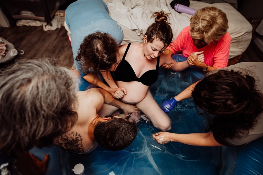 Mother giving birth at home
