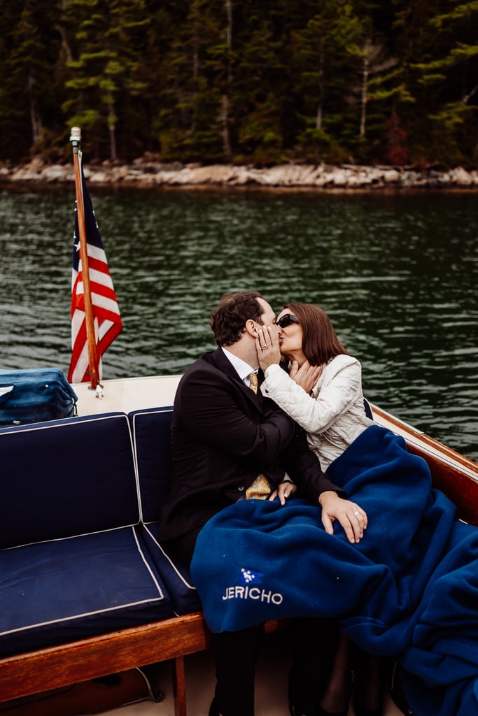 Bride and groom kissing on the back on Jericho Boat
