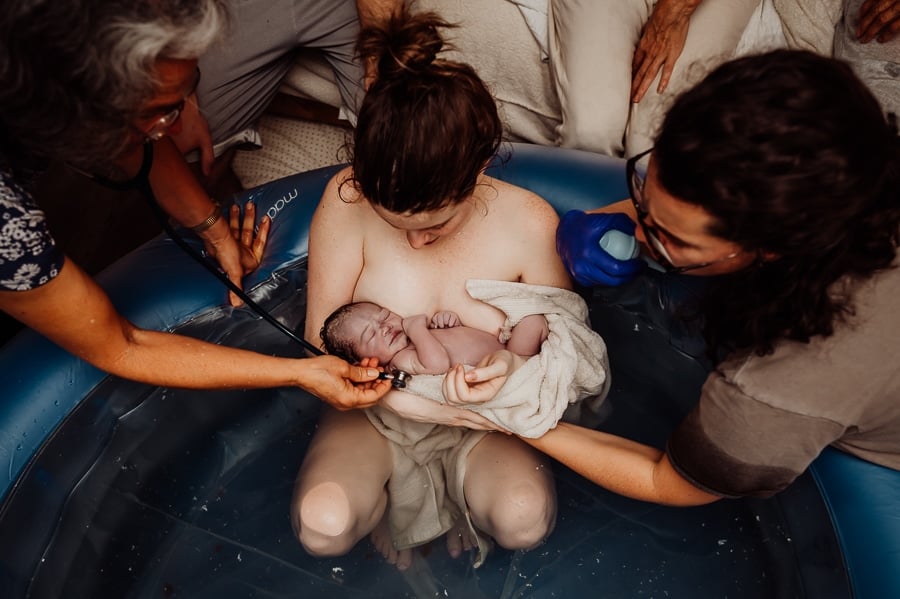 Mother giving birth at home