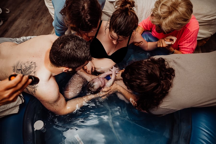 Mother giving birth at home