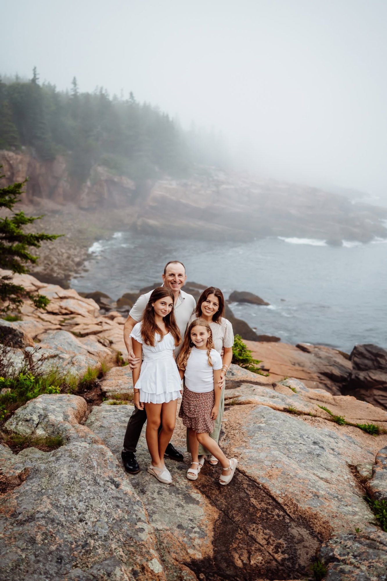 Family in fog in acadia