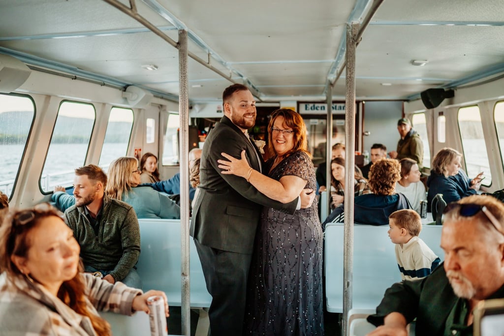 Groom dancing with his mother aboard the Eden Star charter boat during a Bar Harbor wedding celebration.