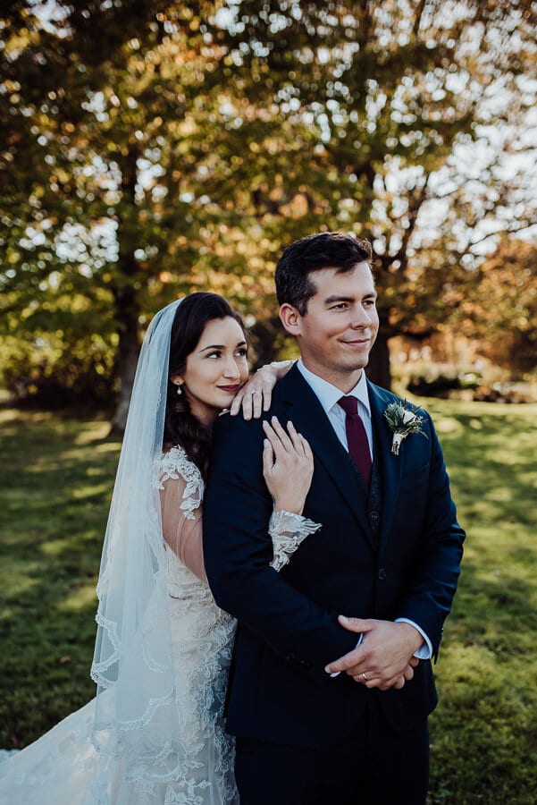 Bride behind groom photography