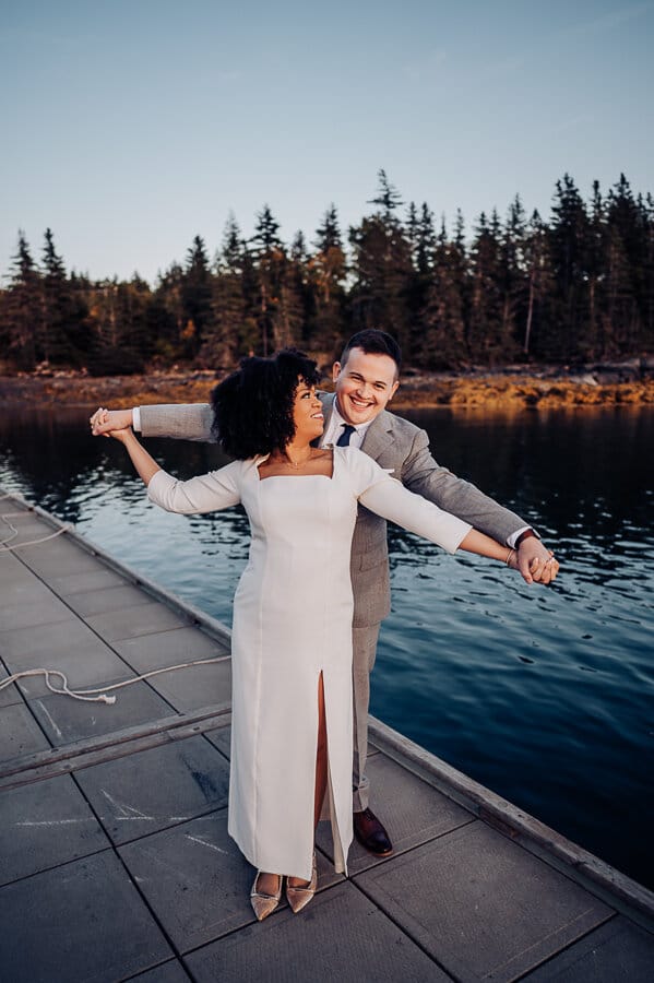 Bride and groom on swans island dock