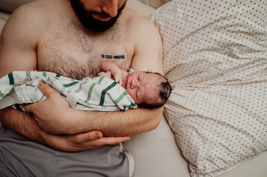 Woman giving birth at home