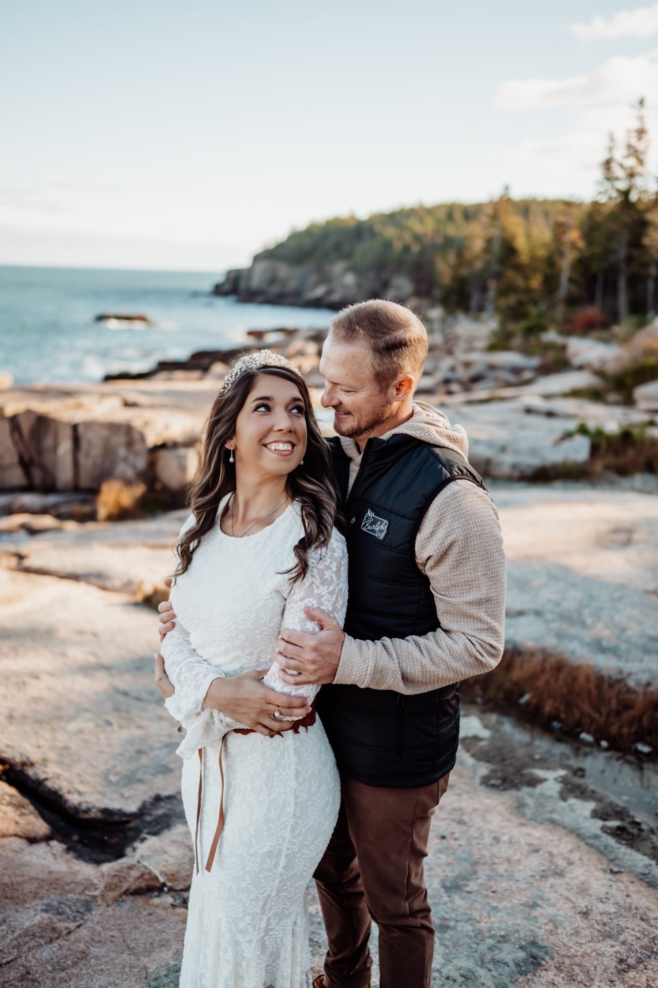 Romantic coastal portrait on granite ledges during fall elopement in Acadia.