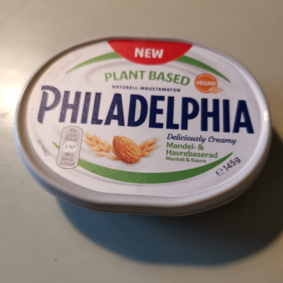 A tub of vegan cream cheese called Philadelphia Plant Based Almon and Oat. 