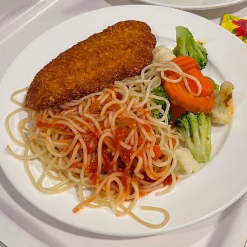 Plant-based schnitzel and spaghetti with tomato sauce