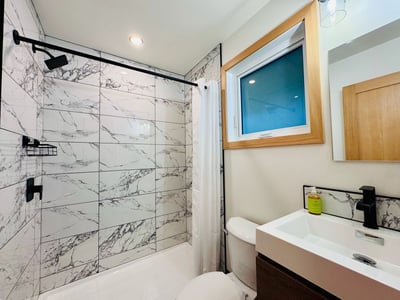 Newly renovated bathroom found in the Superior Rooms at The Elkhorn Lodge in Banff, AB