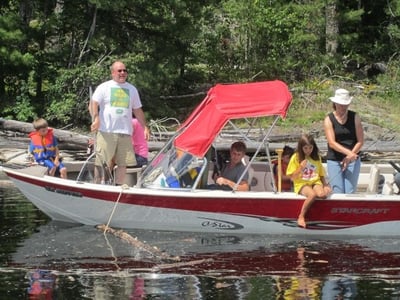 An entire family preparing for a day of action on the lake near the Algoma Motel in Wawa Ontario Canada