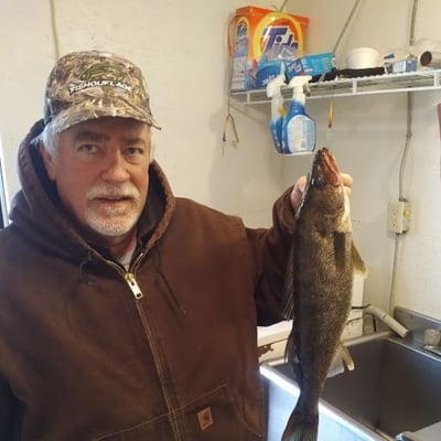 A happy Algoma Motel customer enjoying his days catch in Wawa Ontario
