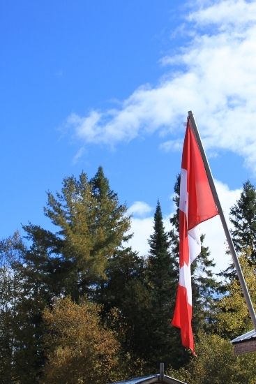 A Canadian flag flying near the Great Outdoors close to the Algoma Motel in Wawa Canada