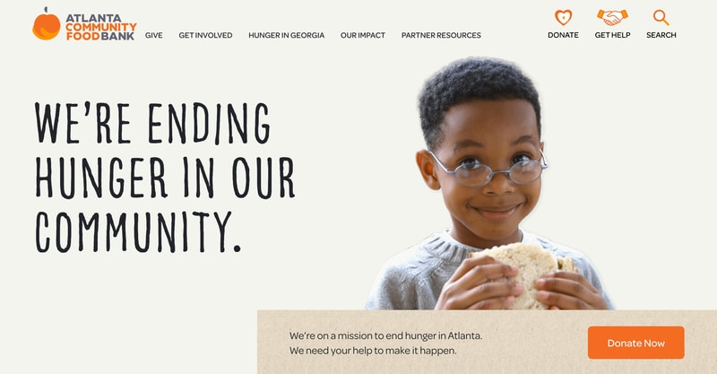 Atlanta Community Food Bank homepage hero with handwritten-style ending hunger headline and Donate Now mission bar