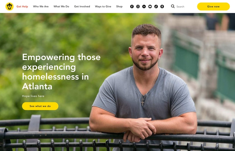 Atlanta Mission homepage hero with empowering those experiencing homelessness headline and Get Help first in the navigation