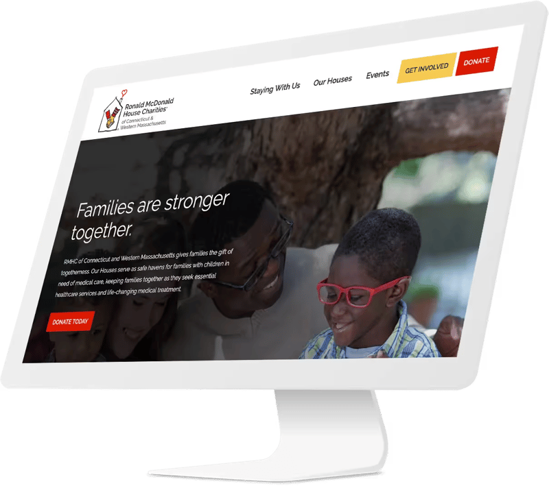 rendering of a desktop computer showing the redesigned website homepage of Ronald McDonald House Charities