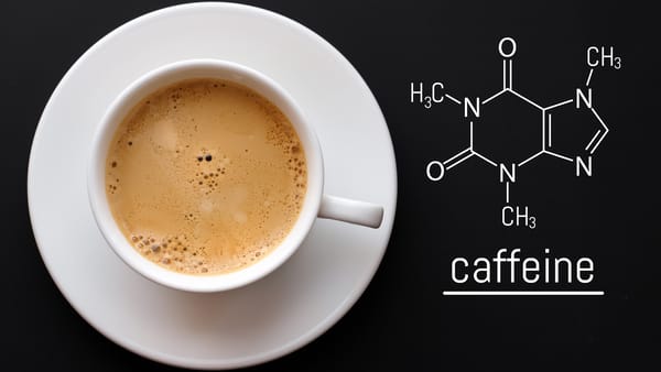 Coffee beans and a cup of coffee, illustrating Candida coffee alternatives