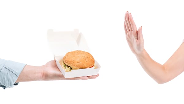 Fast food burger in wrapper that contains forever chemicals