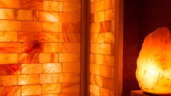 A Himalayan salt lamp glowing in a sauna