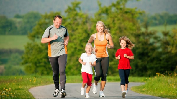 Family of different ages enjoying exercise time together