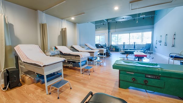 A Progressive Medical Center practitioner with a patient
