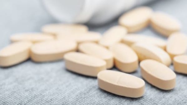 Quinolone antibiotic pills spilled on a piece of cloth