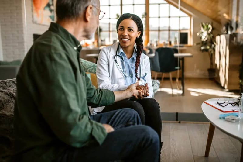 Hospice doctor talking with patient