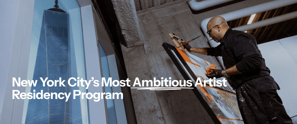 New York City’s Most Ambitious Artist Residency Program — an artist painting in the Silver Art studio overlooking One World Trade Center