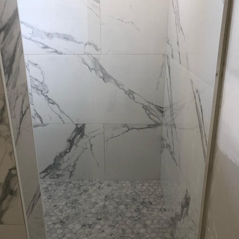 Marble work done on bathroom wall and floor