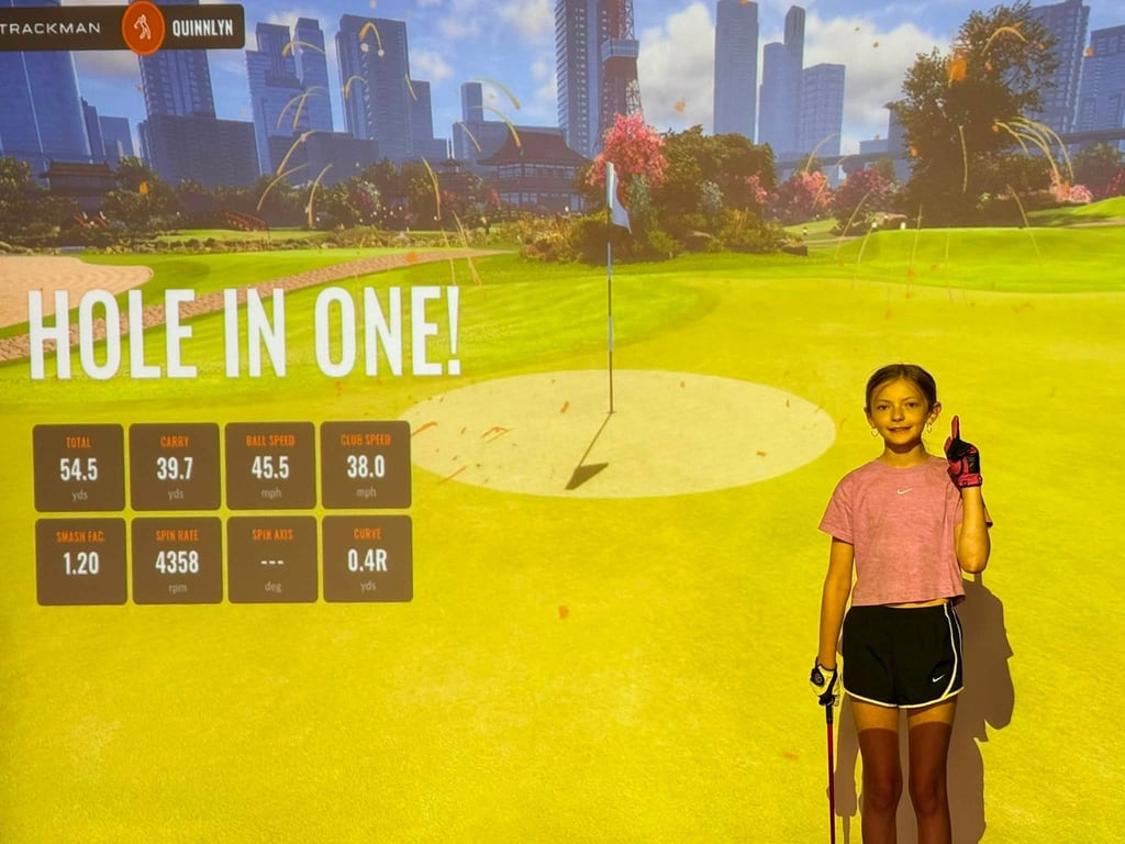 Quinnlyn L. after their hole-in-one at Tokyo Gardens