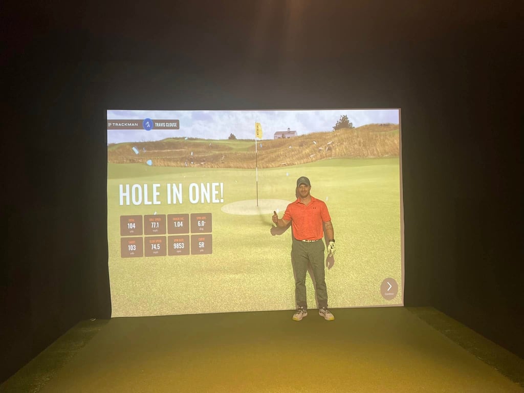 Travis Clouse after their hole-in-one