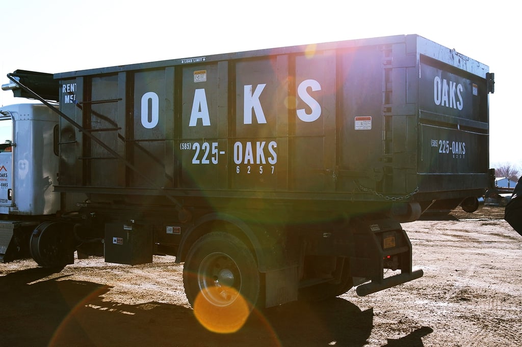 A large dump truck with Oaks written on the side