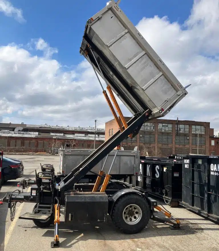 Trailer with lift gate, industrial area, dumpster