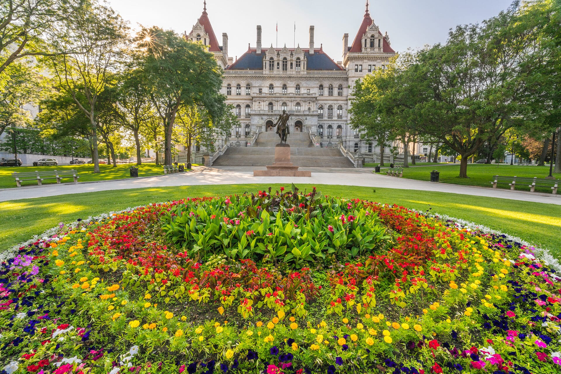 The Vermont State House with a flower garden