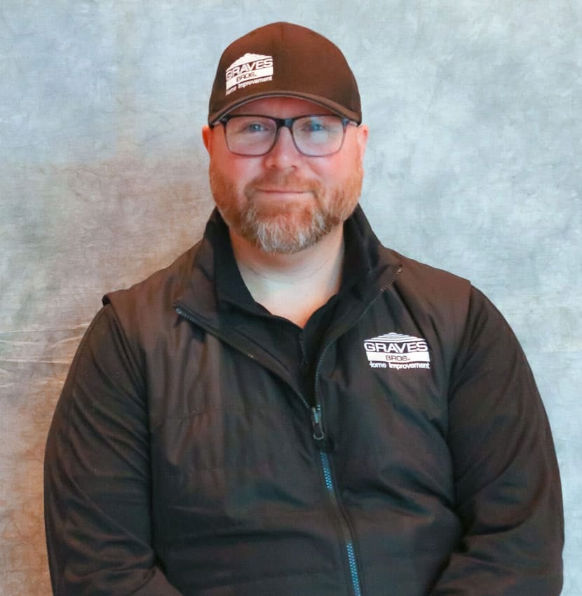 a man in a black jacket and hat