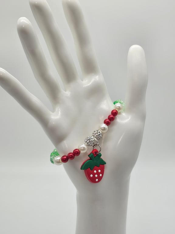Red, Green, and White Beaded Bracelet with Strawberry Charm — photo 1