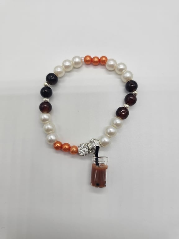 White and Orange Beaded Charm Bracelet — photo 2